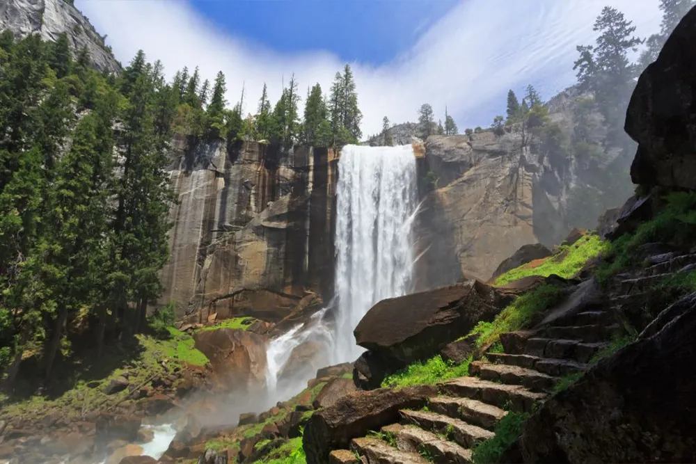 Vernal Falls with view on granite steps on mist trail to the top of 317-foot waterfall, Yosemite National Park California