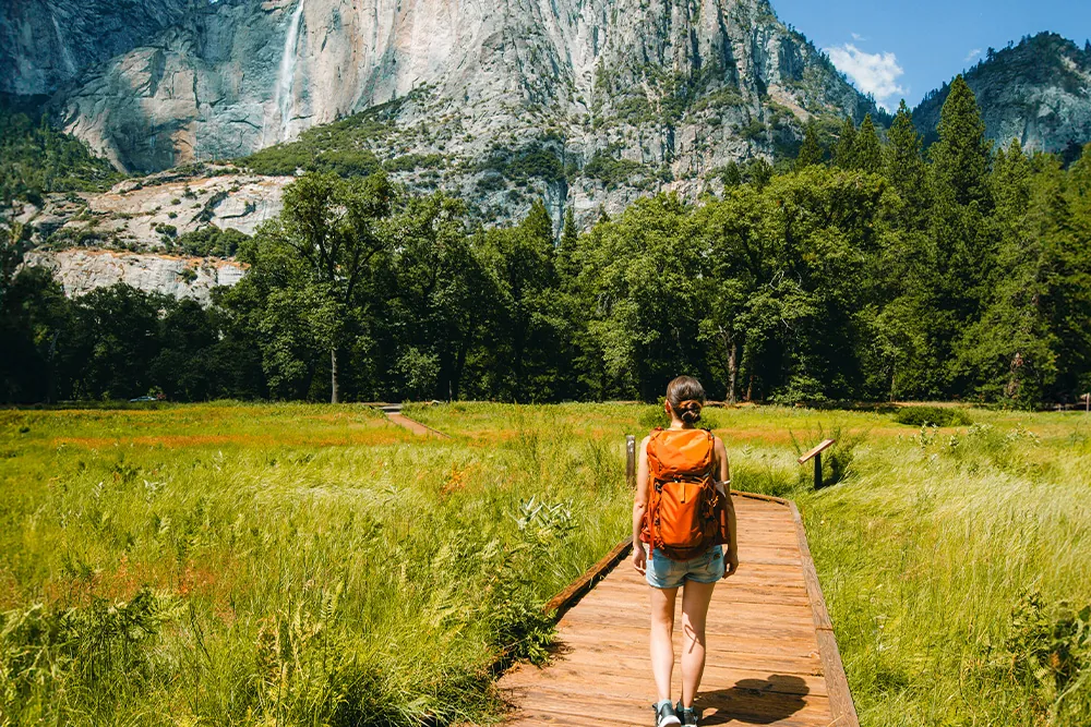 Girl walking on a trail at Yosemite National Park **NEEDS PHOTO CREDIT**